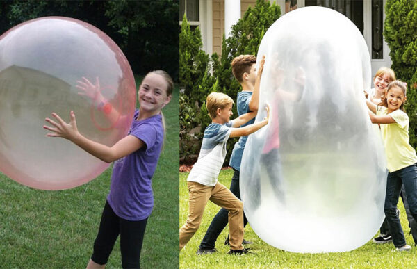 grandchildren playing with the giant jelly balloon ball