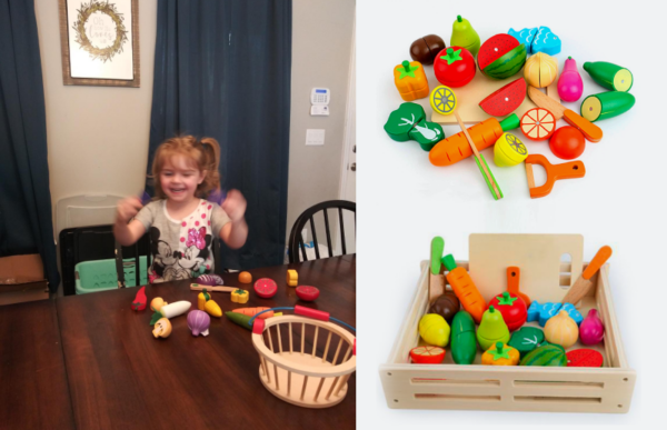 a young daughter playing with the fruit and veggie cutting set