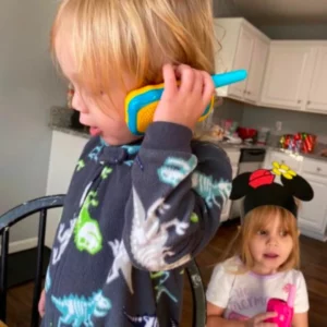 grandchildren communicating through the walkie talkie set