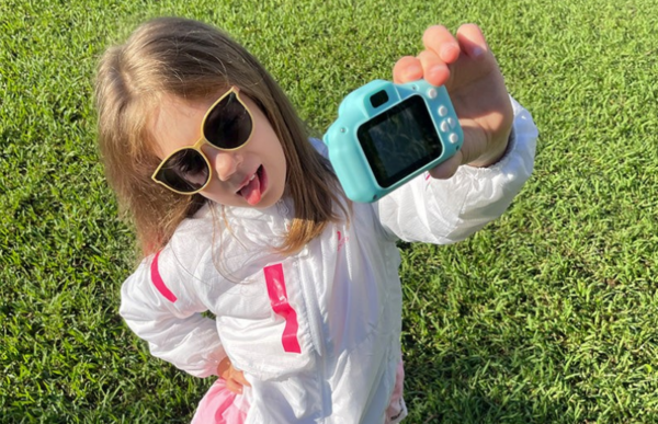 kids taking a selfie using the littlelens kids camera