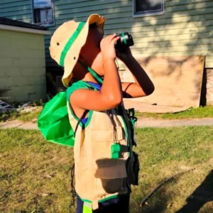 grandson using the binoculars included in the nature explorer kit