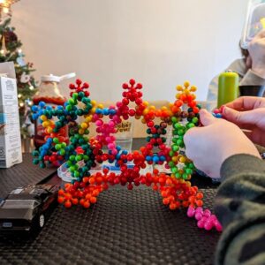 a grandchild playing with the plum blossom building blocks