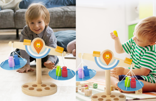 young boys playing with the educational math balance scale toy