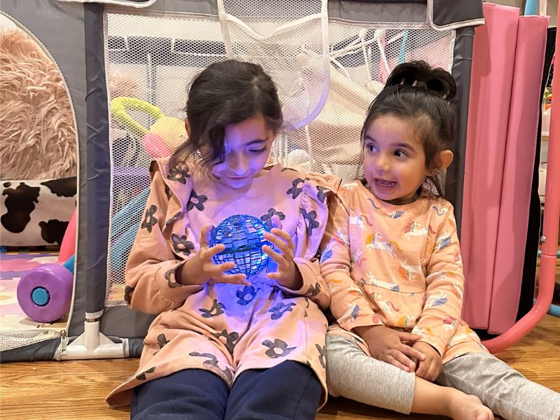 The orb drifting back like a boomerang — kids cheer