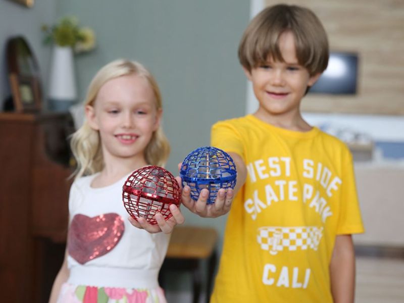 Cousins circling the glowing orb during a family visit