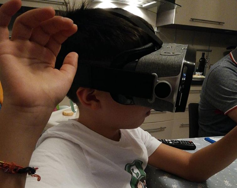 Excited kid playing with VR set