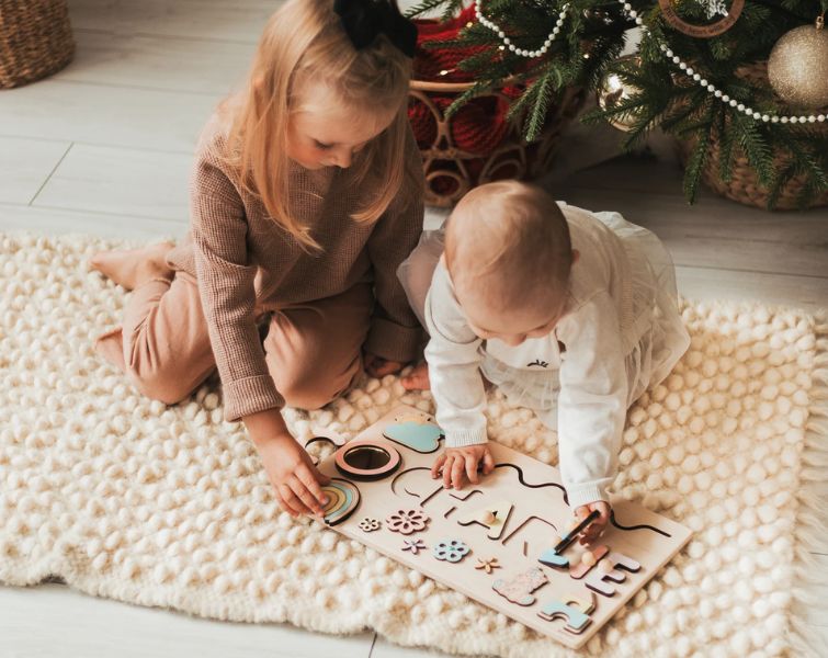 Happy family with custom Montessori board