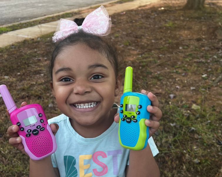 Happy kid with kids walkie talkie