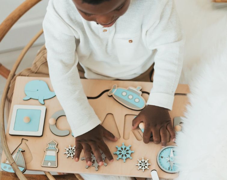 Kid with Montessori board