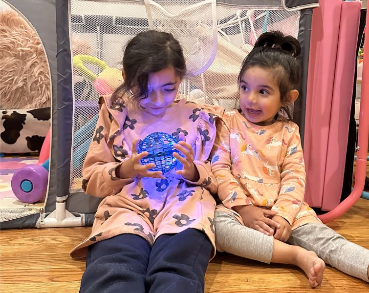 Kids playing with galaxy flying LED