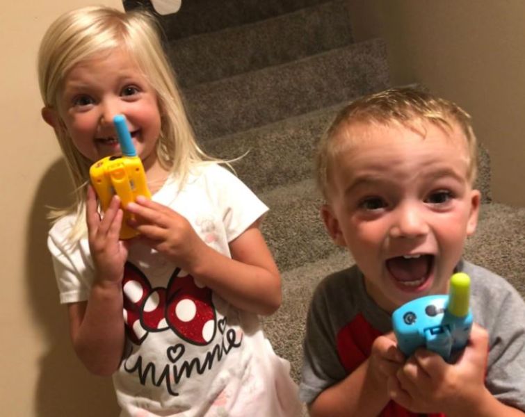Kids playing with walkie talkies