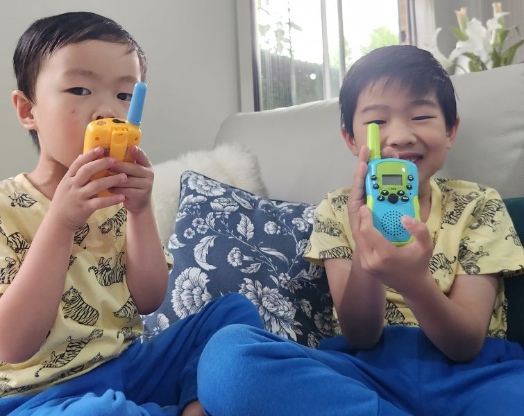 Little boys playing with kids walkie talkie