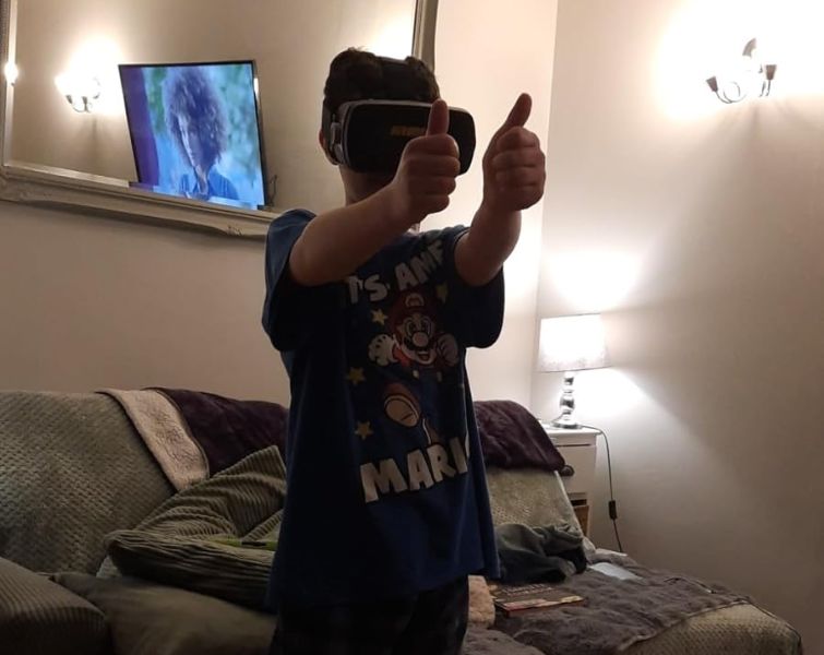 Little kid playing with VR set