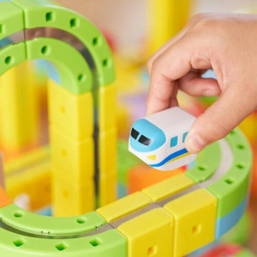 Toddler playing with the Busy Board Montessori toy