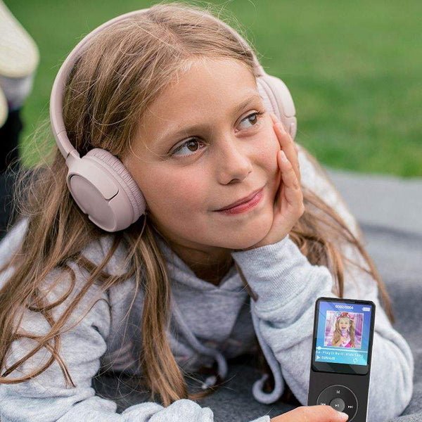 Child listening to the MP3 Player With Headset outdoors